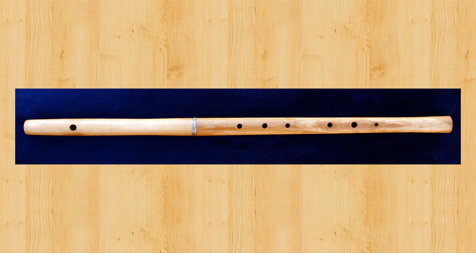 A Martin Doyle Celtic style C flute made from maple wood with a sterling silver ferrule.
