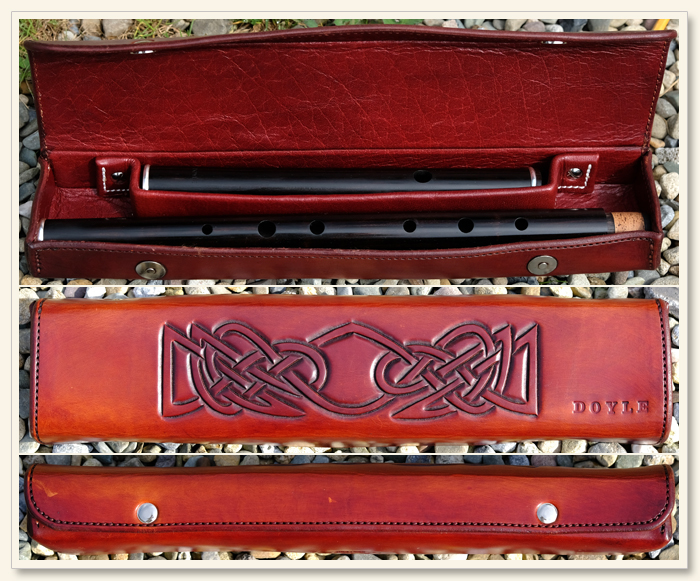 Carved leather flute case.