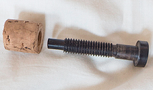 A deconstructed adjustable screw cork mechanism that Martin Doyle offers as an optional extra with his wooden headjoints. The adjustable screw corks allow for the pitch of the flute to be adjusted and are generally only added to headjoints for concert flutes and keyed tradtional flutes.
