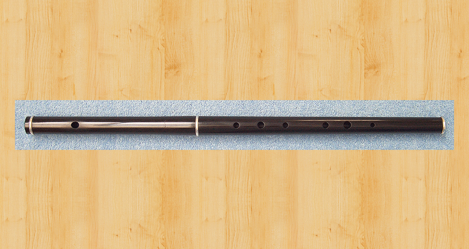 A Martin Doyle Traditional D flute made from African blackwood with three sterling silver ferrules.