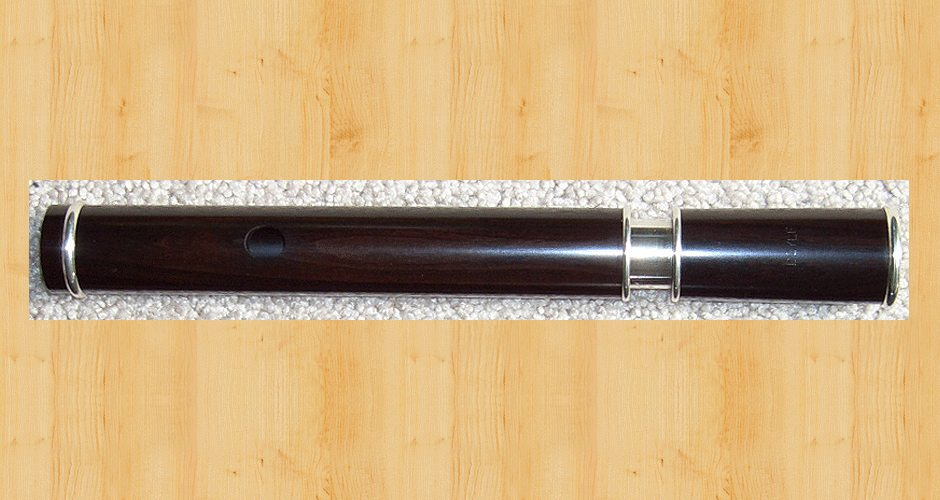 A stirling silver thin-walled tuning slide set in a Martin Doyle Traditional style keyless D flute made from African Blackwood. Note that the metal of the tuning slide does not come down the head as far as the embouchure hole.
